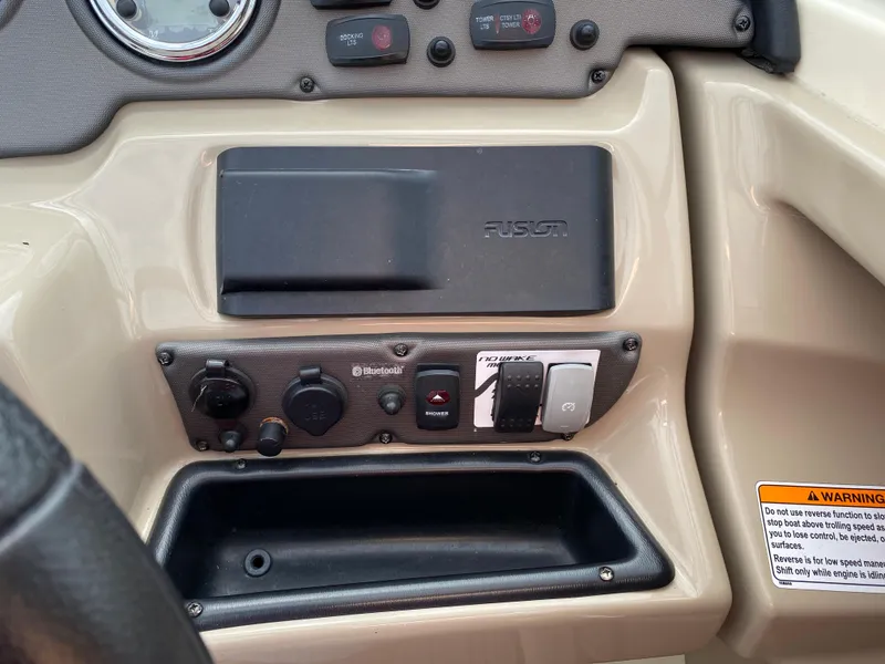 Slide: The Image of Control panel of a 2014 Yamaha Boats 242 Limited S with Fusion audio system. - 28