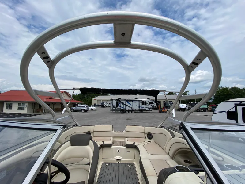 Slide: The Image of 2014 Yamaha Boats 242 Limited S interior with open seating and sleek design. - 31