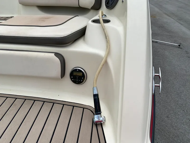 Slide: The Image of 2014 Yamaha Boats 242 Limited S deck with seating and hose attachment. - 35