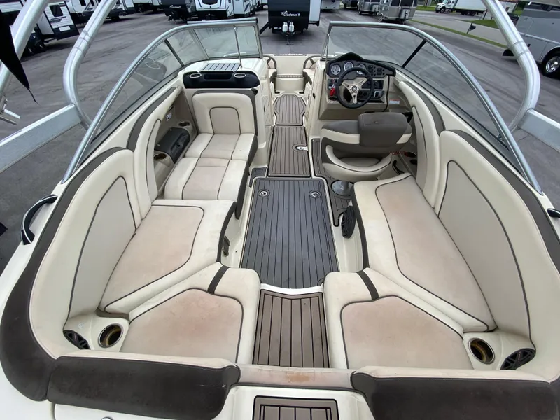 Slide: The Image of 2014 Yamaha Boats 242 Limited S interior with spacious seating and modern dashboard. - 4
