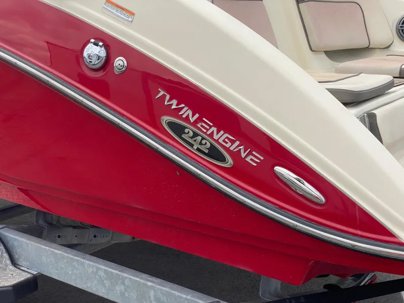 Slide: The Image of 2014 Yamaha Boats 242 Limited S, red twin-engine boat detail on trailer. - 45