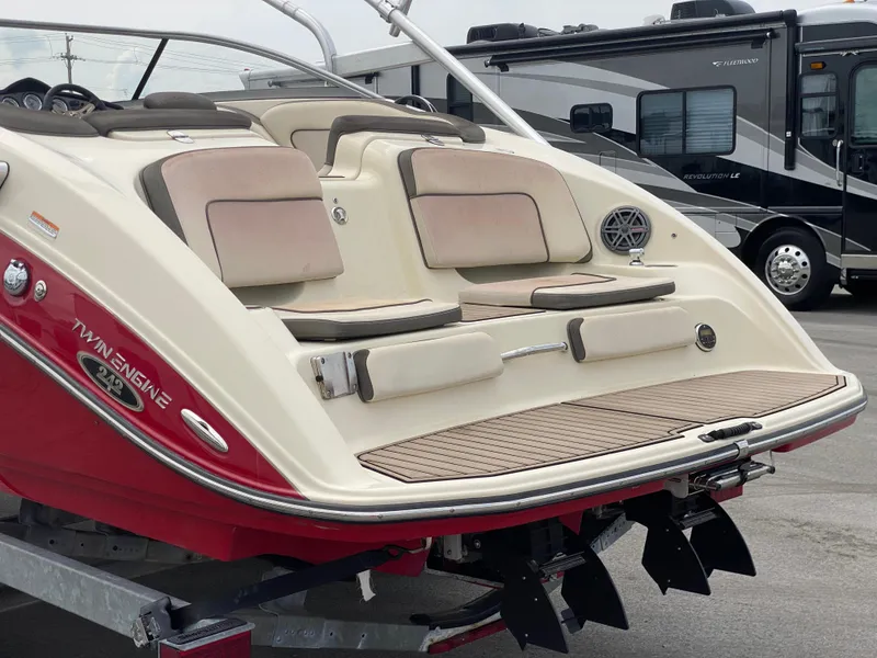 Slide: The Image of 2014 Yamaha Boats 242 Limited S, rear view, showcasing twin engine and seating area. - 47
