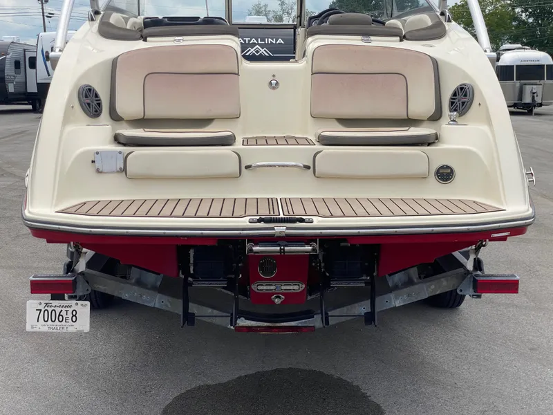 Slide: The Image of 2014 Yamaha Boats 242 Limited S rear view, showcasing swim platform and seating. - 49