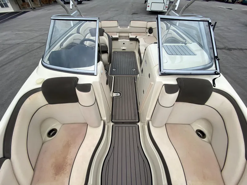 Slide: The Image of 2014 Yamaha Boats 242 Limited S interior with dual windshields and spacious seating. - 5