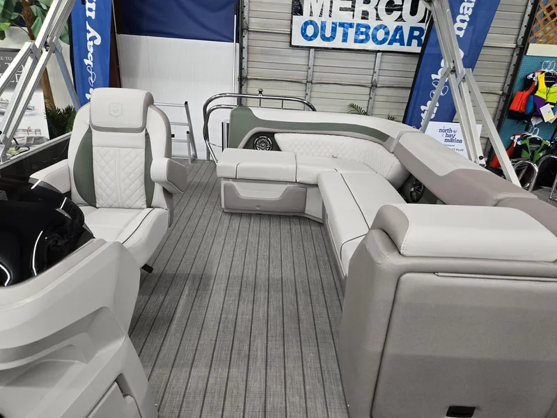 Slide: The Image of 2025 Godfrey Sweetwater 2086 C pontoon boat interior with plush seating and modern design. - 12
