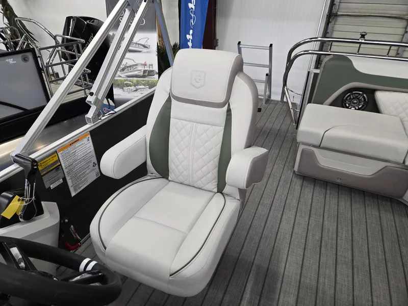 Slide: The Image of Captain's chair on 2025 Godfrey Sweetwater 2086 C pontoon boat, featuring elegant upholstery. - 14