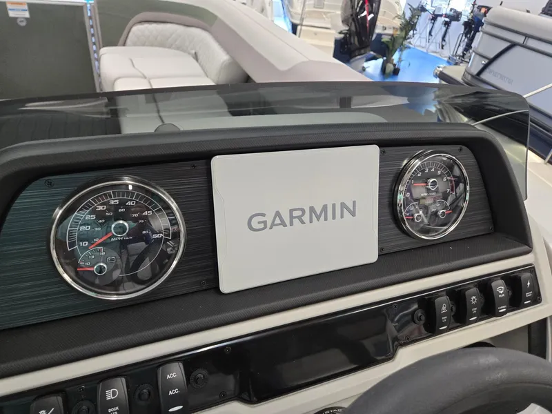Slide: The Image of Dashboard of 2025 Godfrey Sweetwater 2086 C boat with Garmin display and gauges. - 15