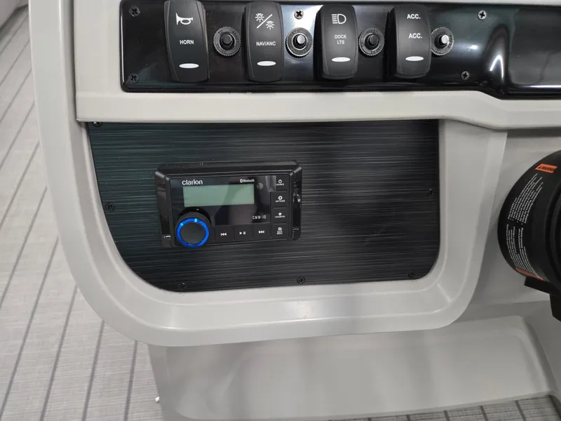 Slide: The Image of Control panel of 2025 Godfrey Sweetwater 2086 C boat with Clarion stereo system. - 16