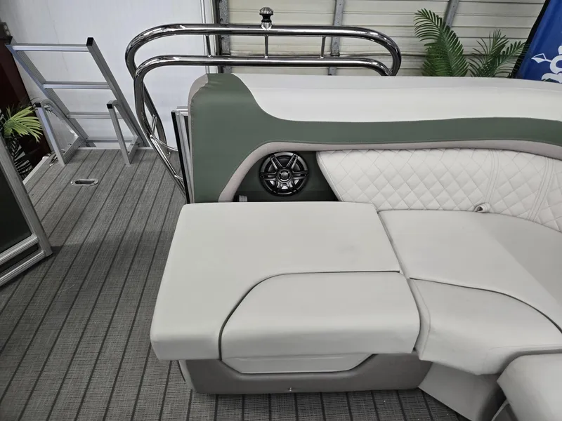 Slide: The Image of 2025 Godfrey Sweetwater 2086 C boat interior with cushioned seating and speaker. - 21
