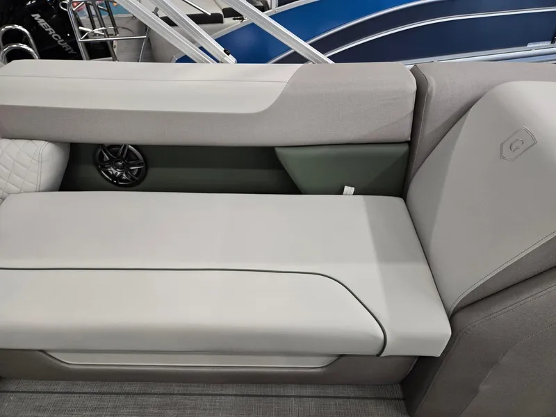 Slide: The Image of 2025 Godfrey Sweetwater 2086 C boat interior with gray seating and speaker. - 23