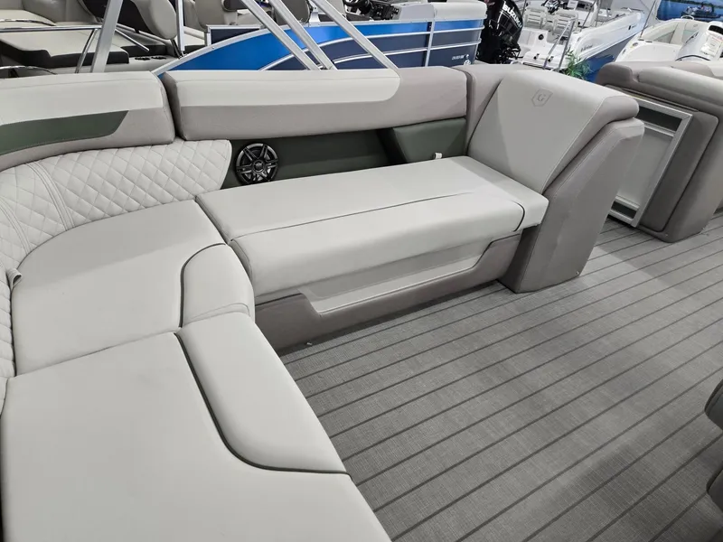 Slide: The Image of 2025 Godfrey Sweetwater 2086 C boat interior with plush seating and modern design. - 29