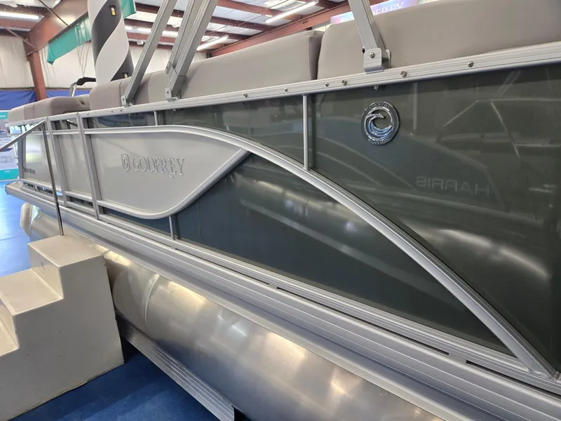 Slide: The Image of 2025 Godfrey Sweetwater 2086 C pontoon boat in showroom, side view. - 3
