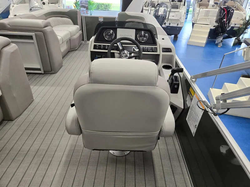 Slide: The Image of 2025 Godfrey Sweetwater 2086 C boat interior with captain's chair and control panel. - 30