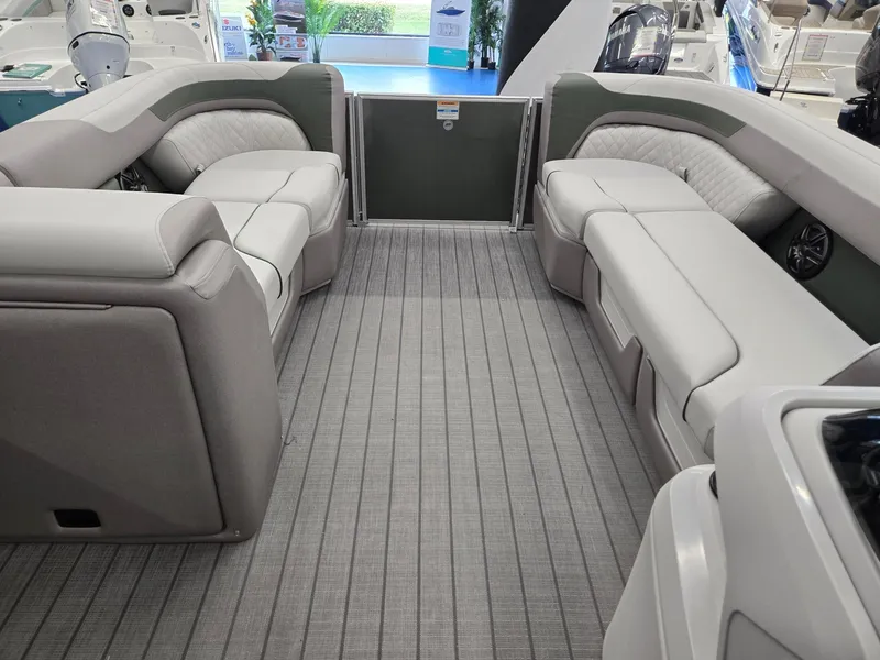 Slide: The Image of 2025 Godfrey Sweetwater 2086 C pontoon boat interior with plush seating and modern design. - 33
