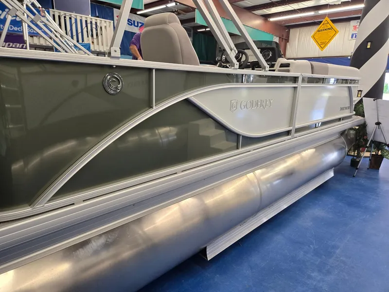 Slide: The Image of 2025 Godfrey Sweetwater 2086 C pontoon boat displayed indoors. - 7