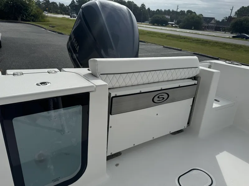 Slide: The Image of 2025 Sportsman Open 212 Center Console boat interior with seating and engine view. - 13