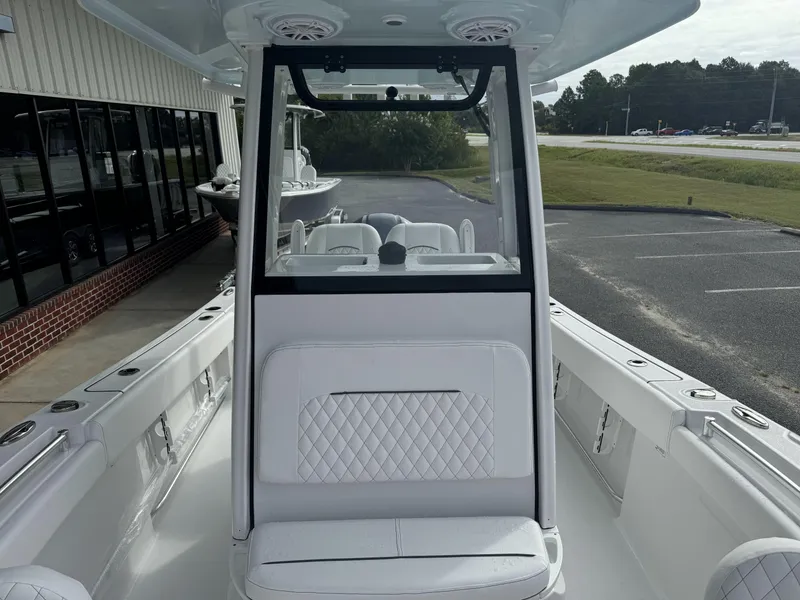 Slide: The Image of 2025 Sportsman Open 212 Center Console boat with sleek white interior and modern design. - 9