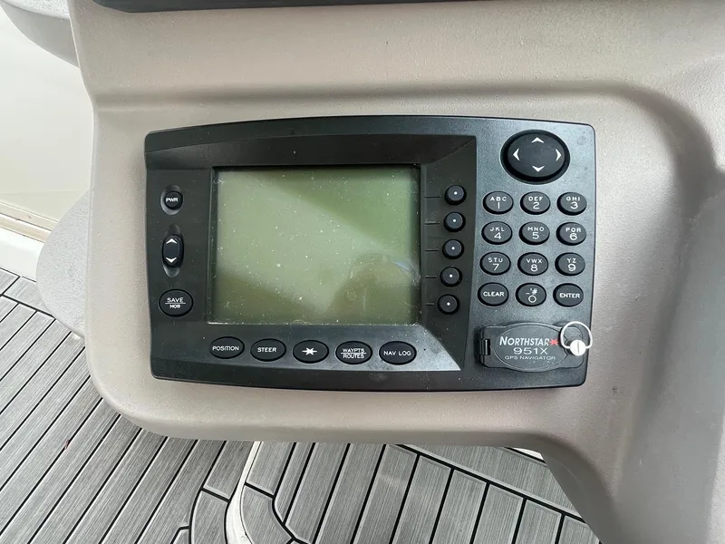 Slide: The Image of Control panel of a 2001 Cruisers Yachts 3870 Express with Northstar 951X navigation system. - 11