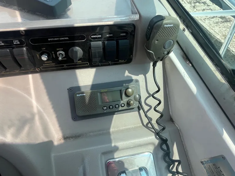 Slide: The Image of 2001 Cruisers Yachts 3870 Express dashboard with radio and control panel. - 14