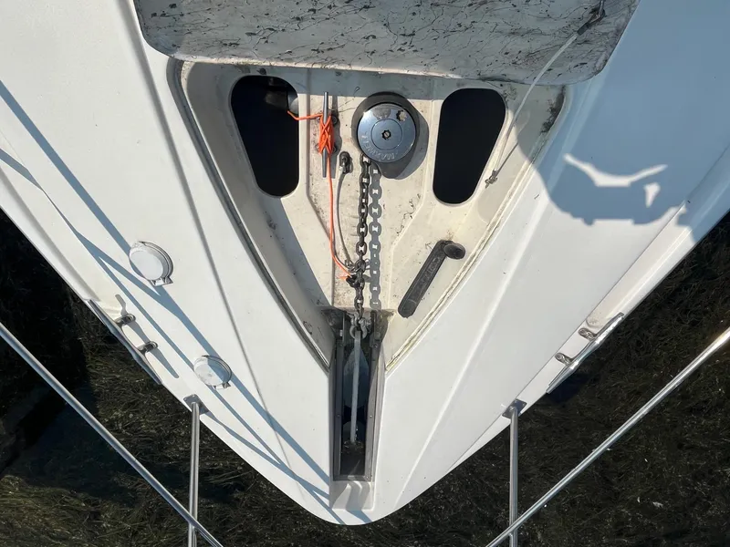 Slide: The Image of Bow of 2001 Cruisers Yachts 3870 Express with anchor chain and winch. - 6