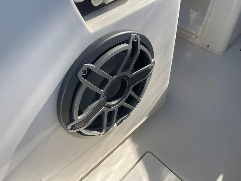 Slide: The Image of Close-up of a speaker on a 2023 Cobia 320 CC boat. - 17