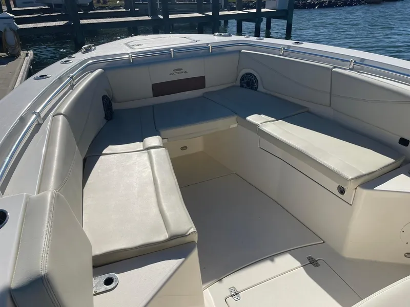 Slide: The Image of 2023 Cobia 320 CC boat interior with spacious seating and sleek design. - 22