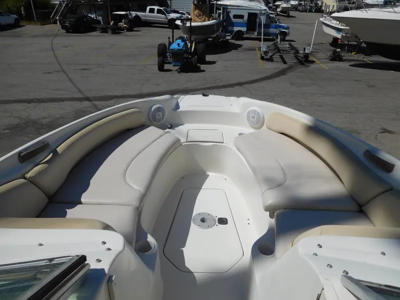 Slide: The Image of 2002 Sea Ray 240 Sundeck boat interior with spacious seating and storage. - 13