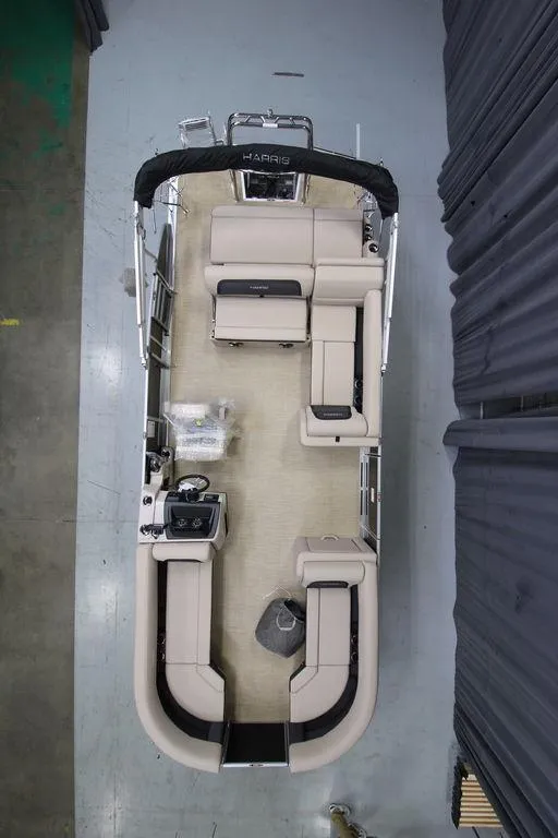 Slide: The Image of 2025 Harris CRUISER 230 SL pontoon boat, aerial view, spacious seating layout. - 2
