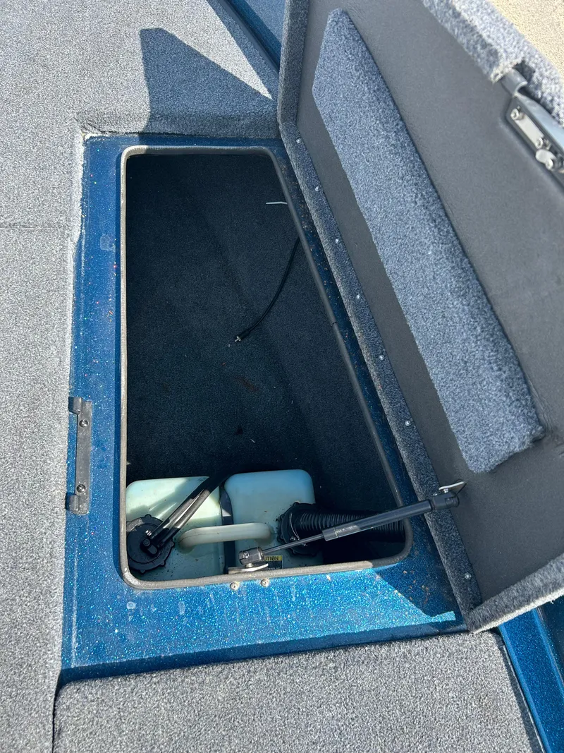 Slide: The Image of Open storage compartment in a 2005 Skeeter WX 1880 boat. - 14