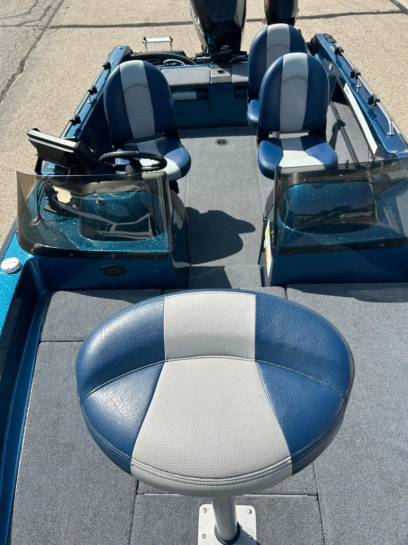 Slide: The Image of 2005 Skeeter WX 1880 boat interior with blue and gray seating. - 18