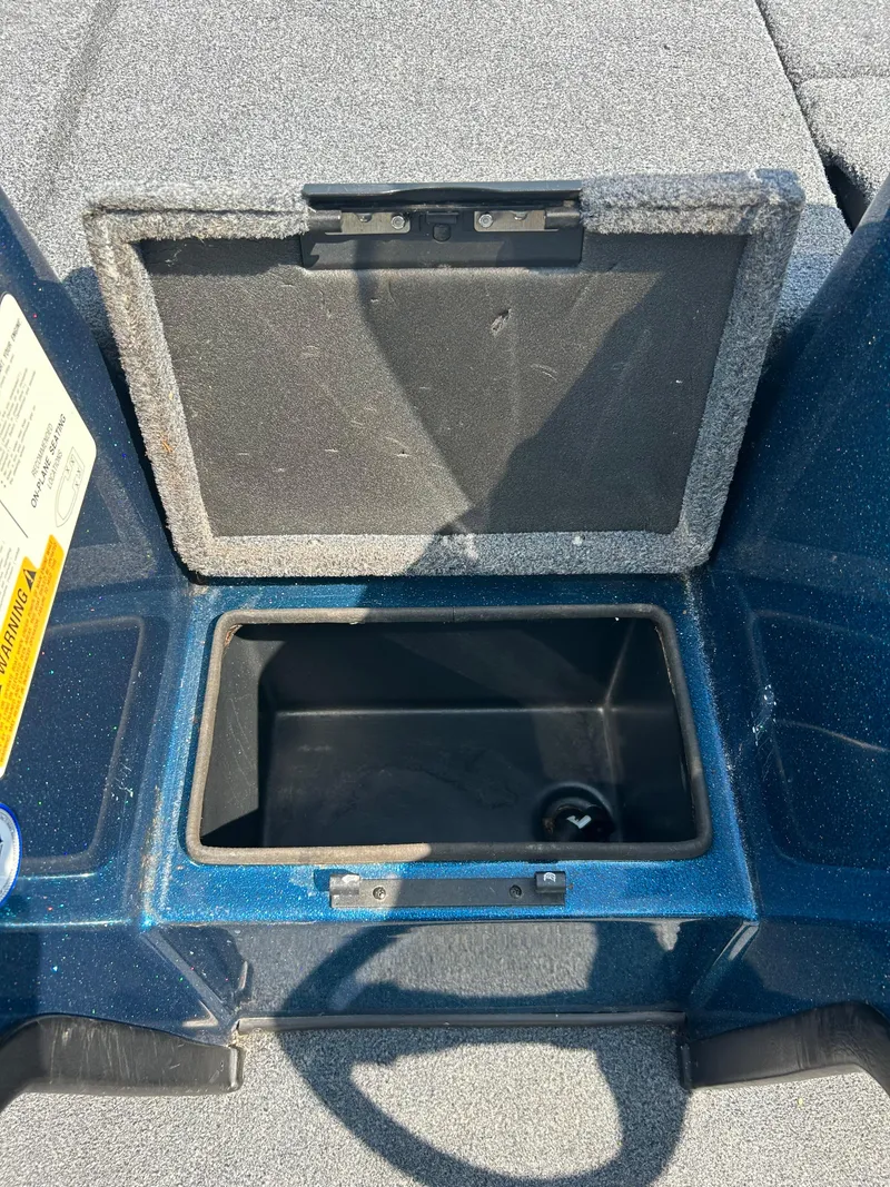 Slide: The Image of Open storage compartment on a 2005 Skeeter WX 1880 boat. - 19