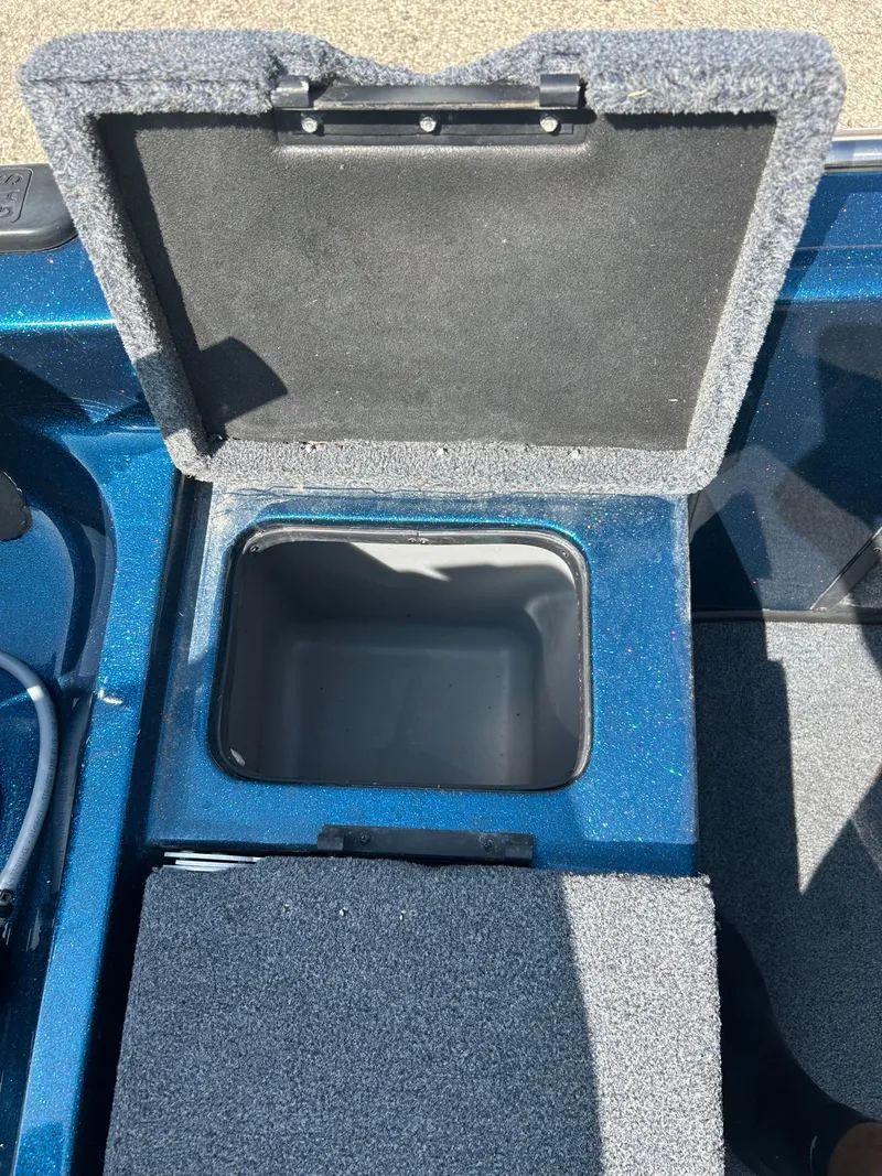 Slide: The Image of Open storage compartment in a 2005 Skeeter WX 1880 boat. - 20