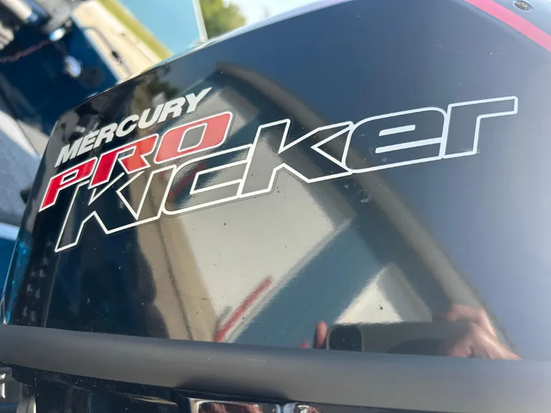 Slide: The Image of Mercury Pro Kicker engine on 2005 Skeeter WX 1880 boat, close-up view. - 24