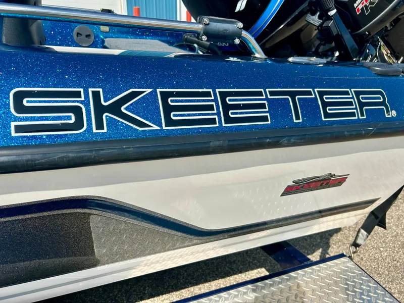 Slide: The Image of 2005 Skeeter WX 1880 boat, close-up of logo and hull design. - 30