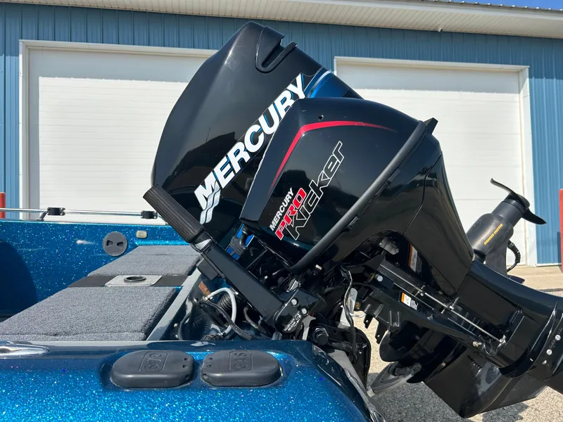 Slide: The Image of 2005 Skeeter WX 1880 boat with Mercury Pro Kicker outboard motor. - 31