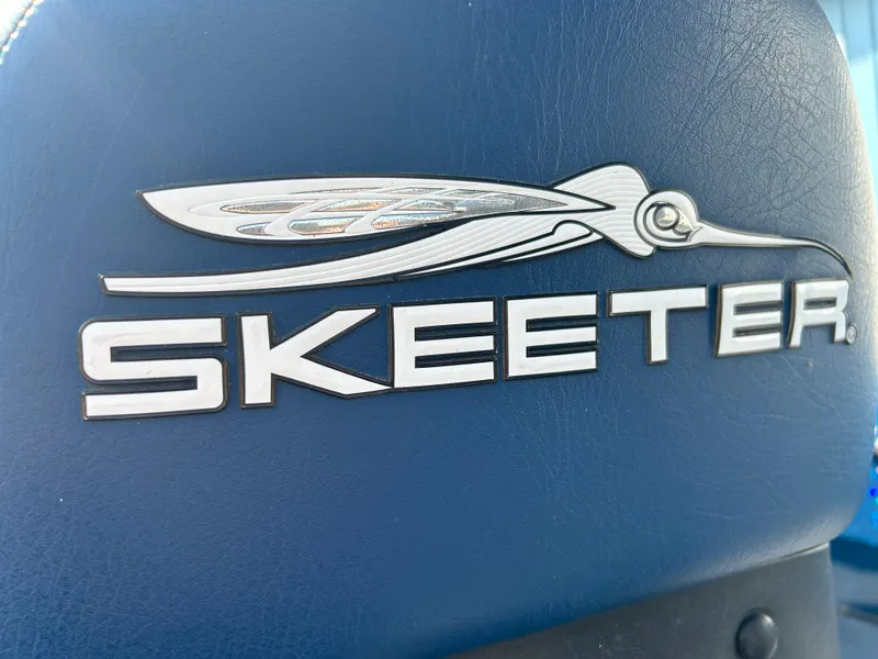 Slide: The Image of Skeeter WX 1880 logo on blue surface, 2005 model boat branding. - 32