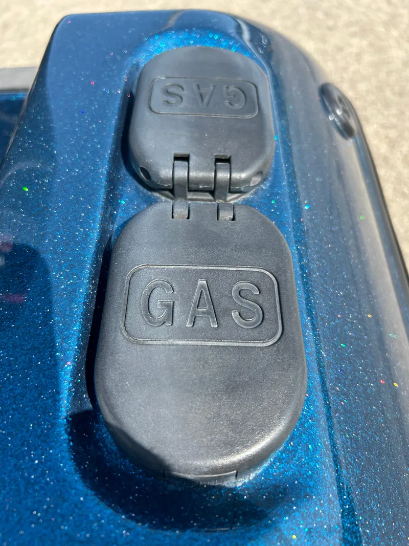 Slide: The Image of Gas cap on 2005 Skeeter WX 1880 boat, blue metallic finish. - 42
