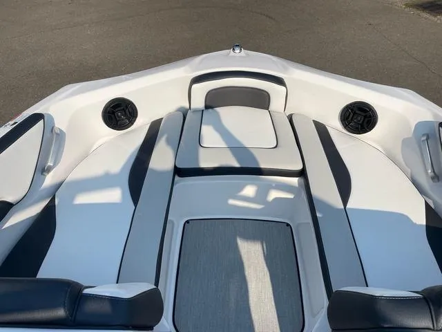 Slide: The Image of 2025 Yamaha AR195 boat interior with sleek seating and built-in speakers. - 5