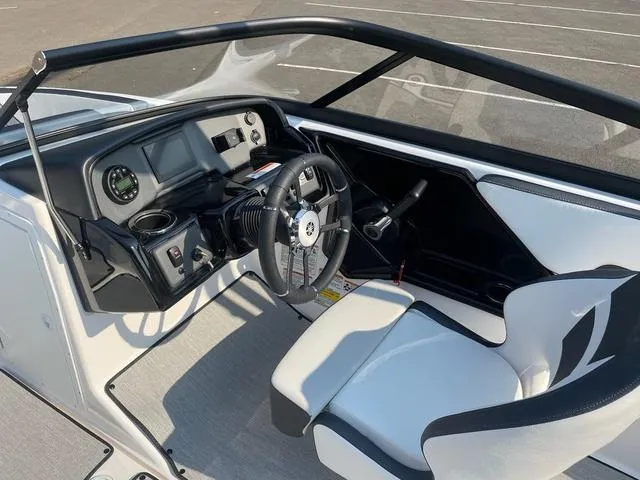 Slide: The Image of 2025 Yamaha AR195 boat interior with steering wheel and dashboard controls. - 6