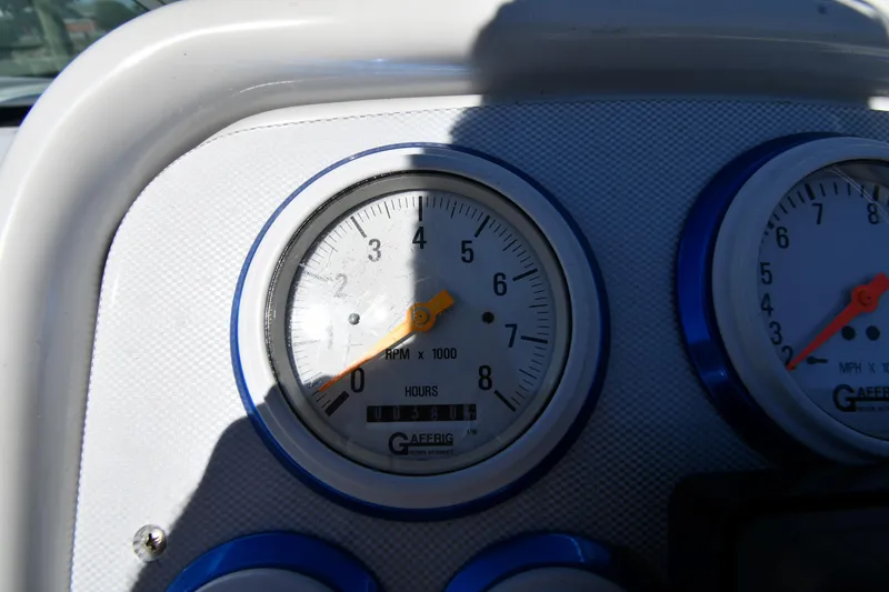 Slide: The Image of Dashboard gauges of a 2003 Formula 353 FASTech boat, showing RPM and hours. - 11