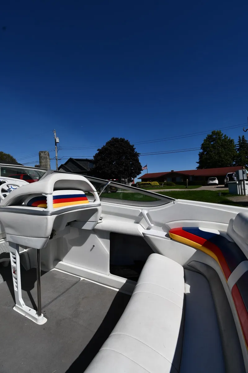 Slide: The Image of 2003 Formula 353 FASTech boat interior with colorful seating under clear blue sky. - 20