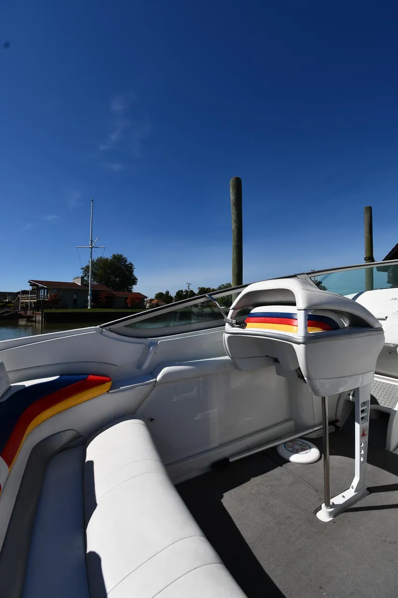 Slide: The Image of 2003 Formula 353 FASTech boat interior with vibrant seating under clear blue sky. - 22