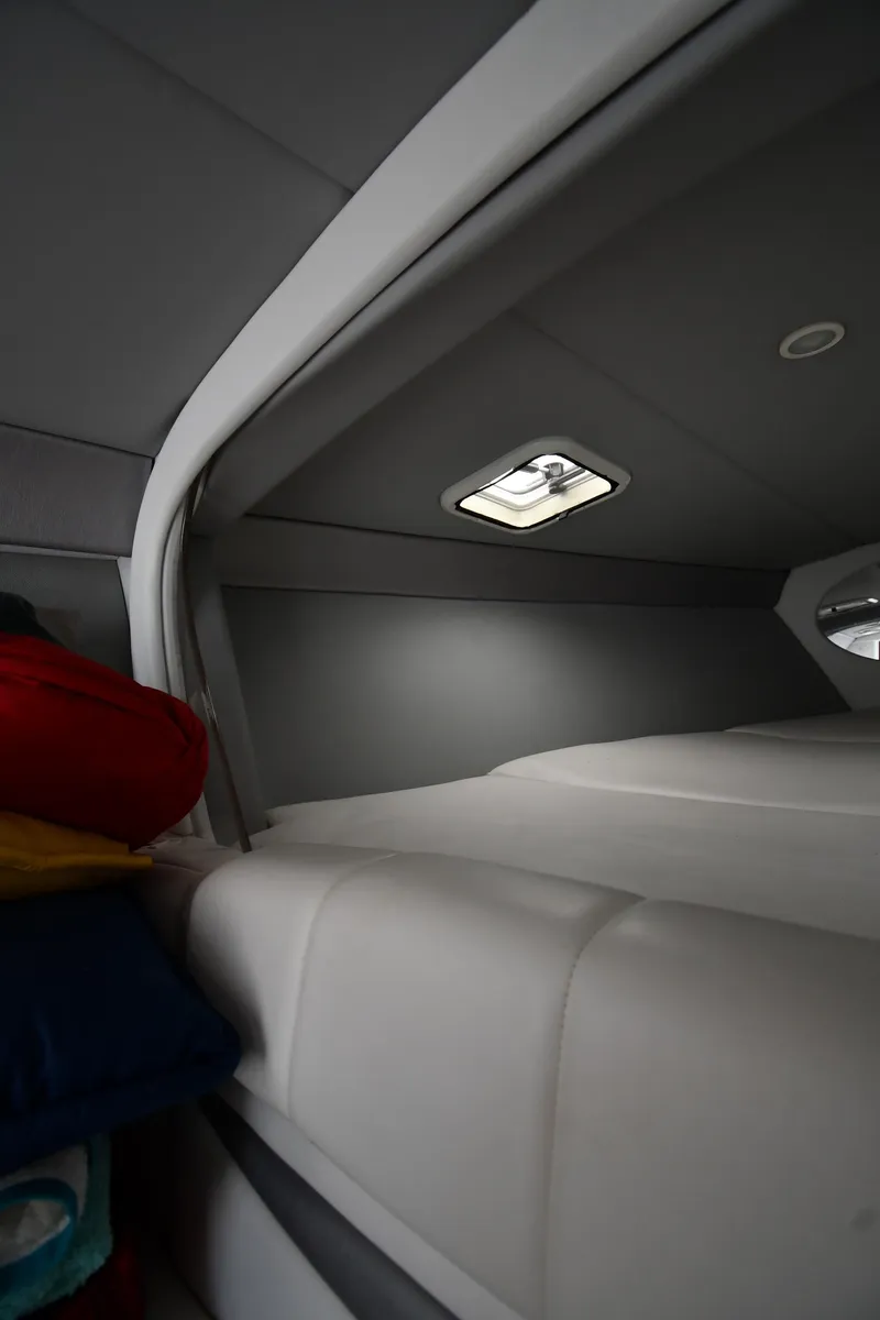 Slide: The Image of Interior cabin of a 2003 Formula 353 FASTech boat, featuring a sleek, modern design. - 28