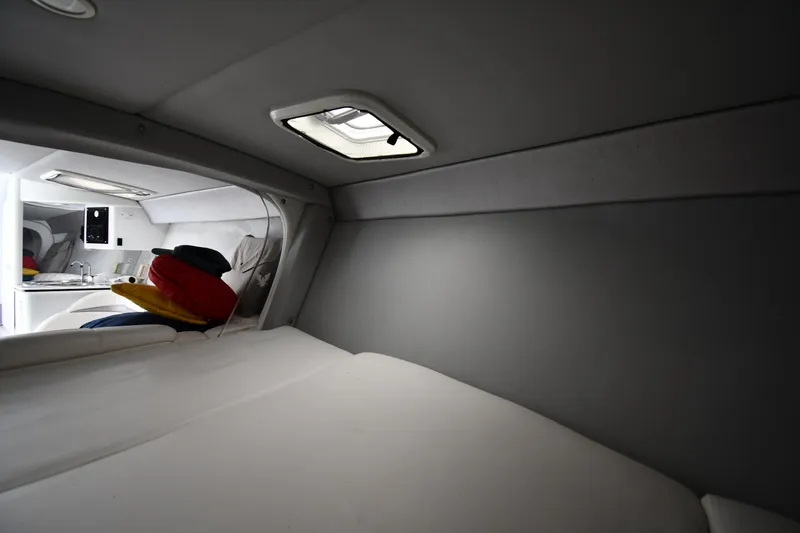 Slide: The Image of Interior cabin of 2003 Formula 353 FASTech boat, featuring a cozy sleeping area. - 29