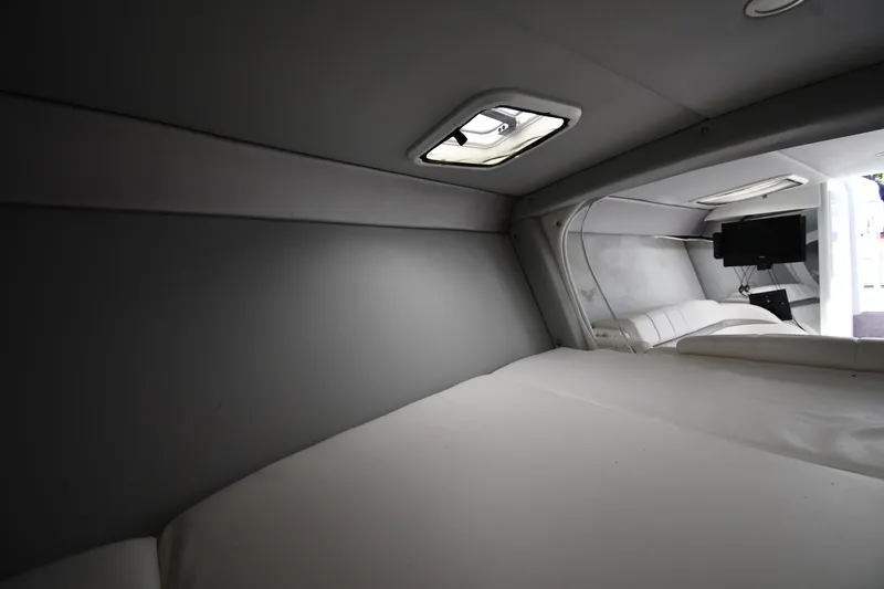 Slide: The Image of Interior cabin of 2003 Formula 353 FASTech boat, featuring a bed and TV. - 30