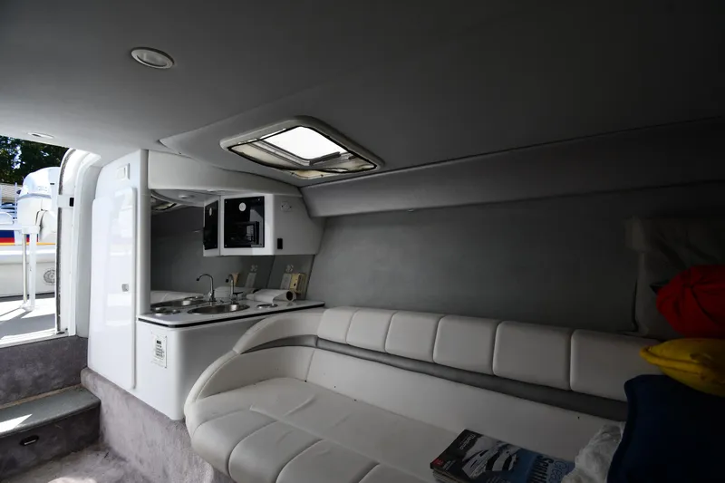 Slide: The Image of Interior of 2003 Formula 353 FASTech boat with kitchenette and seating area. - 35