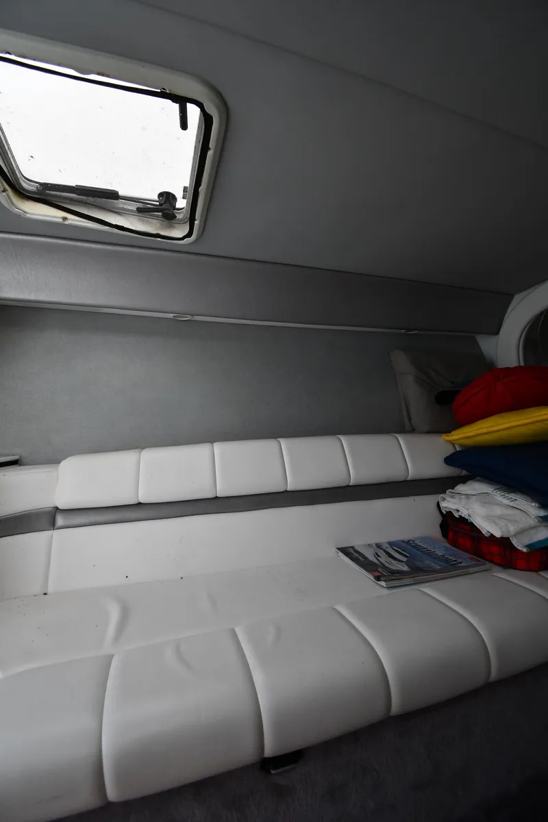 Slide: The Image of Interior cabin of 2003 Formula 353 FASTech boat with white seating and window. - 36