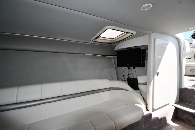 Slide: The Image of 2003 Formula 353 FASTech cabin interior with white seating and a mounted TV. - 37