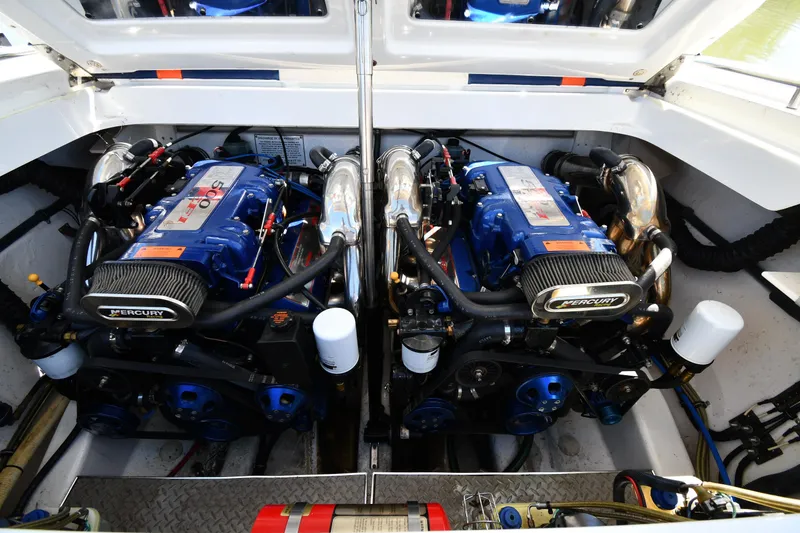 Slide: The Image of Twin Mercury engines in a 2003 Formula 353 FASTech boat engine compartment. - 46