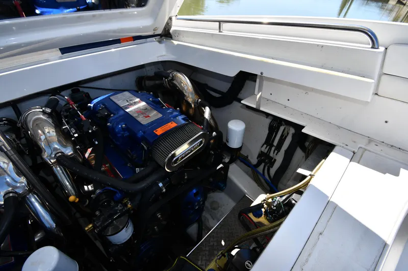 Slide: The Image of 2003 Formula 353 FASTech engine compartment with high-performance components and sleek design. - 47